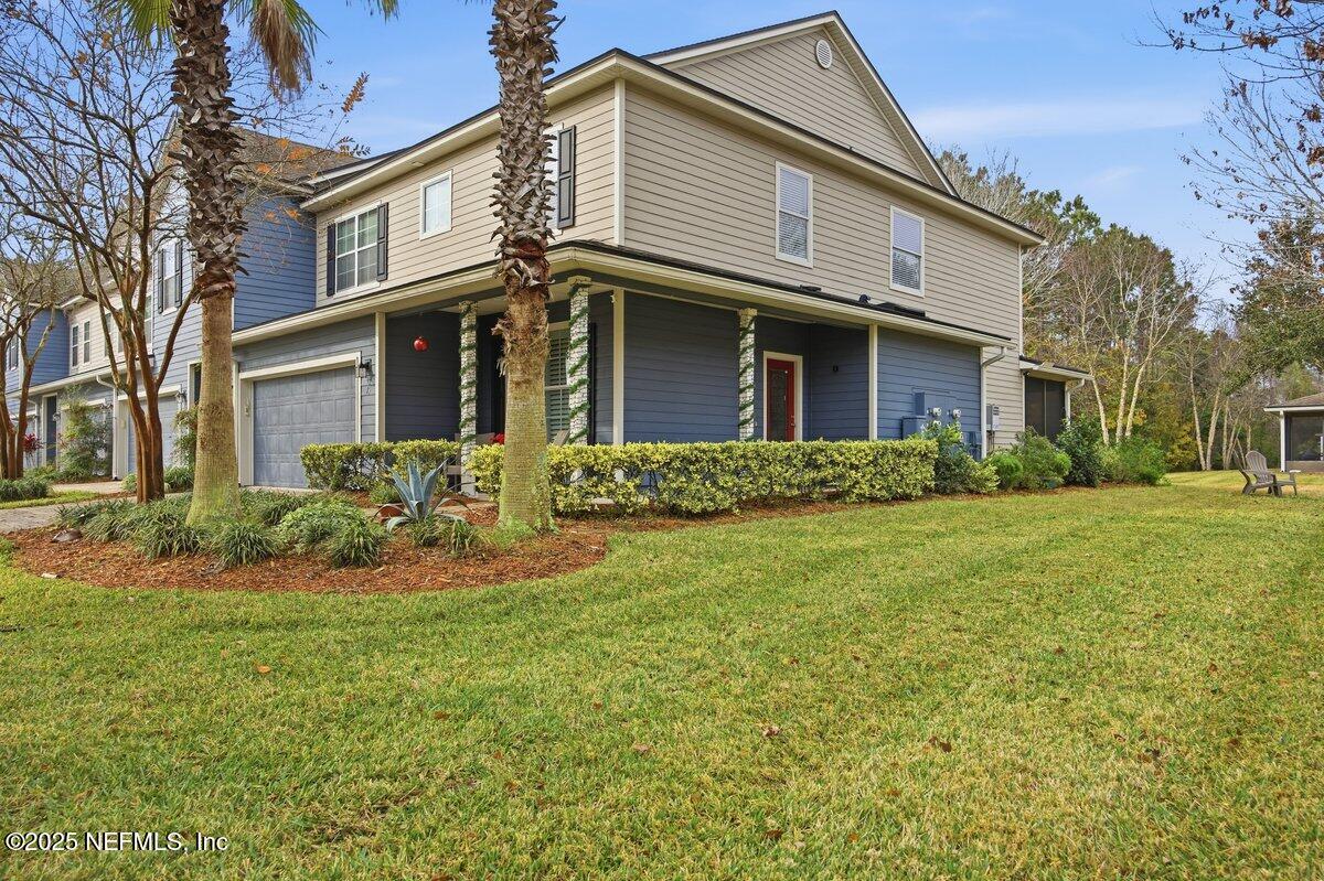 75 Myrtle Park Point Ponte Vedra, FL 32081 - Photo 34 of 38 a front view of a house with a yard