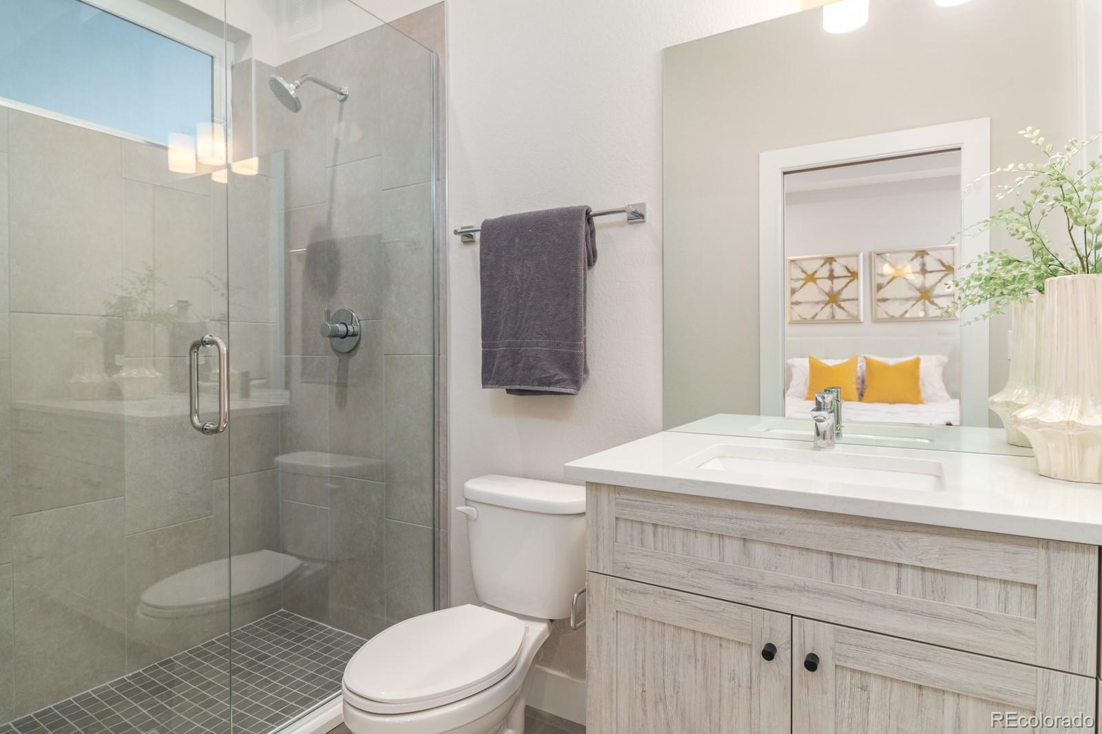 927 Inca Street, Unit 4 Denver, CO 80204 - Photo 15 of 25 a bathroom with a sink a toilet and shower