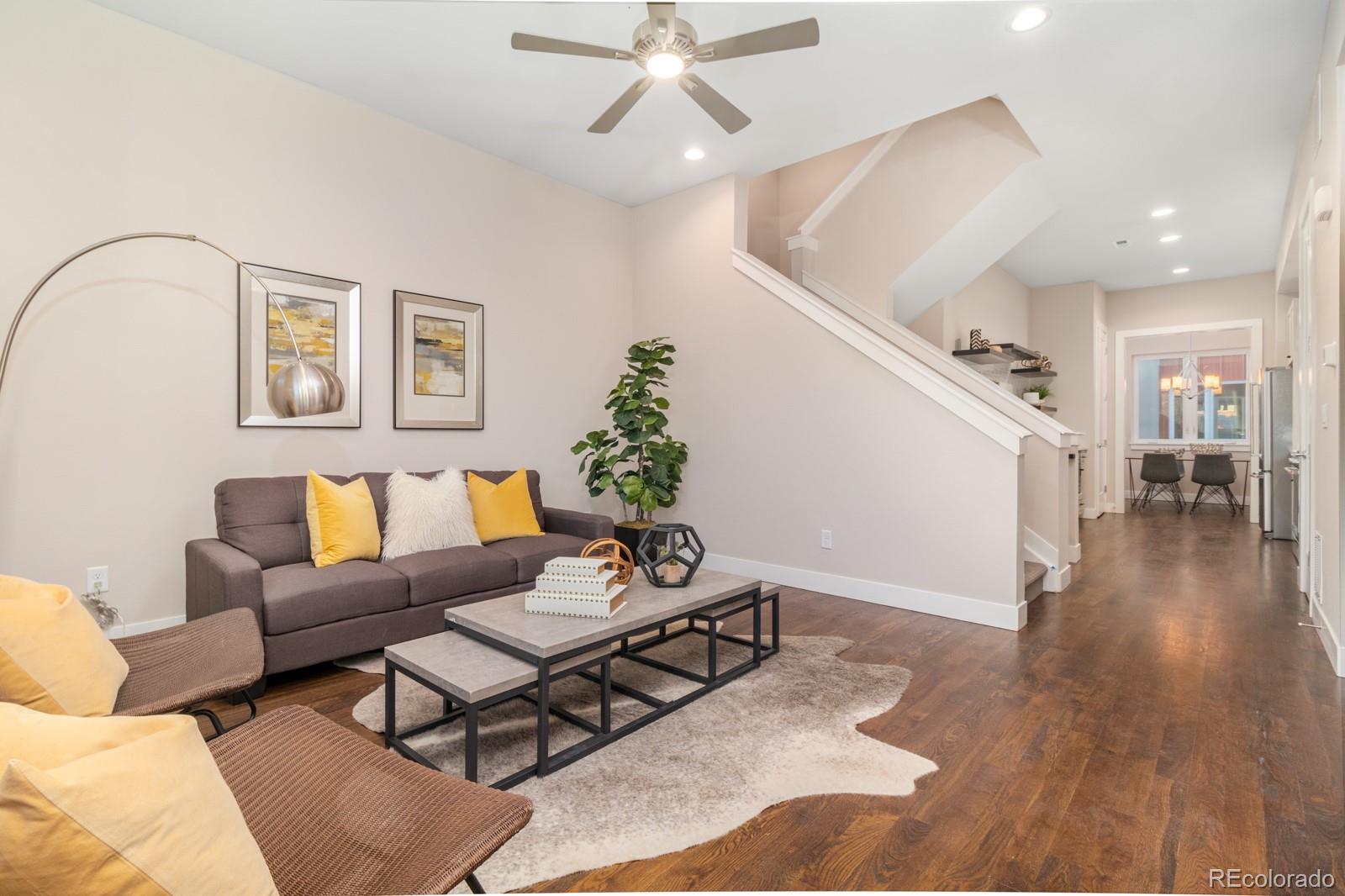 927 Inca Street, Unit 4 Denver, CO 80204 - Photo 5 of 25 a living room with furniture and wooden floor