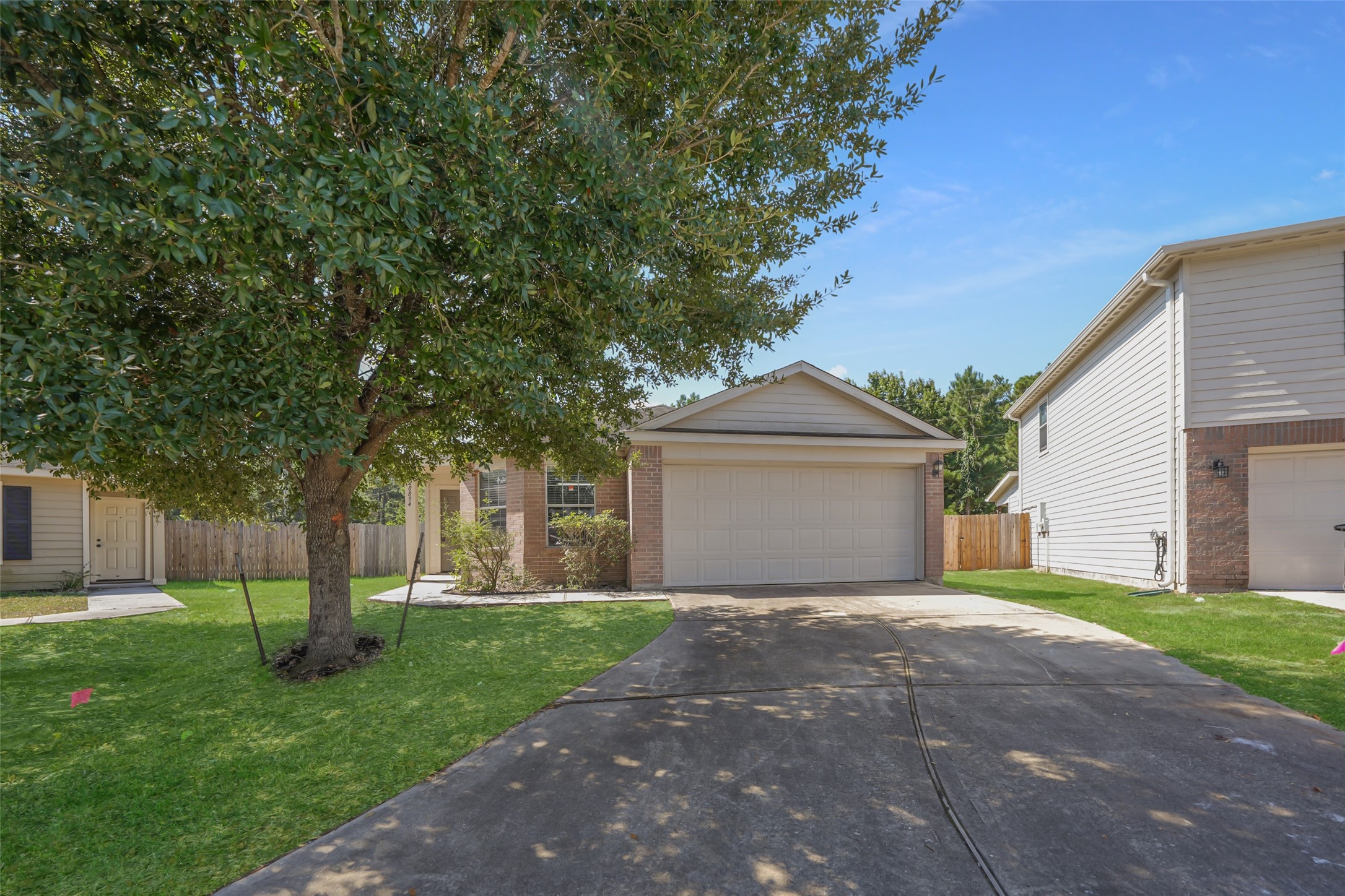 28894 Llano River Loop Spring, TX 77386 - Photo 1 of 33 front view of a house with a yard