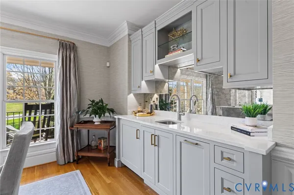 a utility room with sink dryer and washer