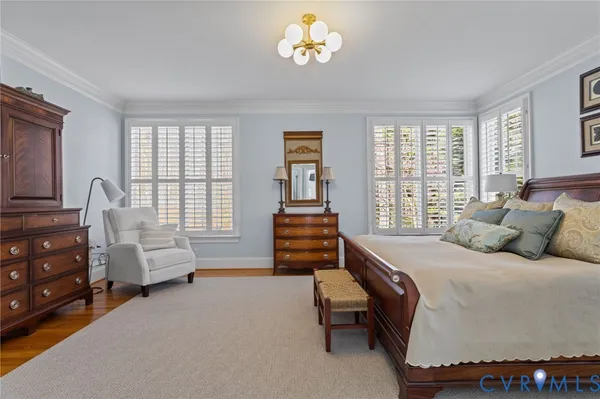 a view of a livingroom with workspace and a window
