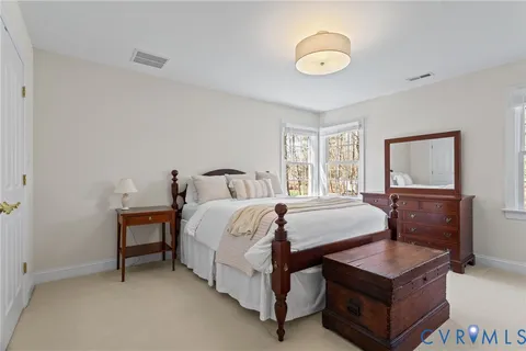 a bedroom with bed and window