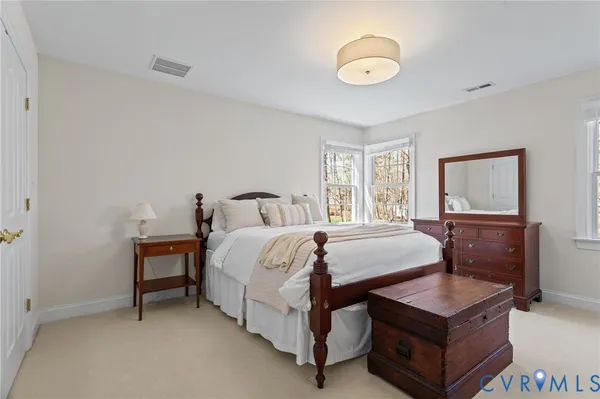 a bedroom with bed and window