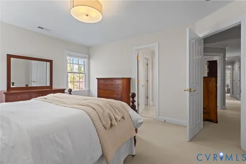 a bedroom with a bed and cabinets