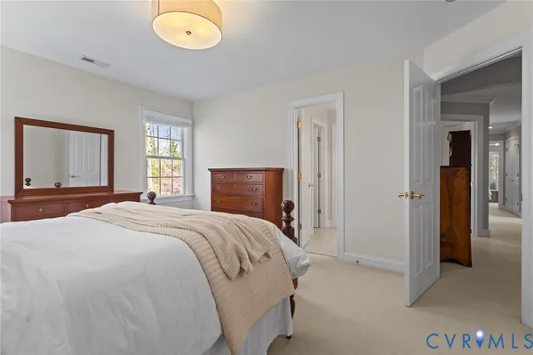a bedroom with a bed and cabinets
