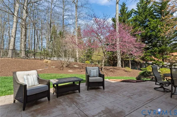 an aerial view of a house with a garden and trees