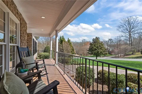 a view of a chairs and tables in the balcony