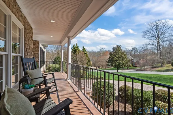 a view of a chairs and tables in the balcony