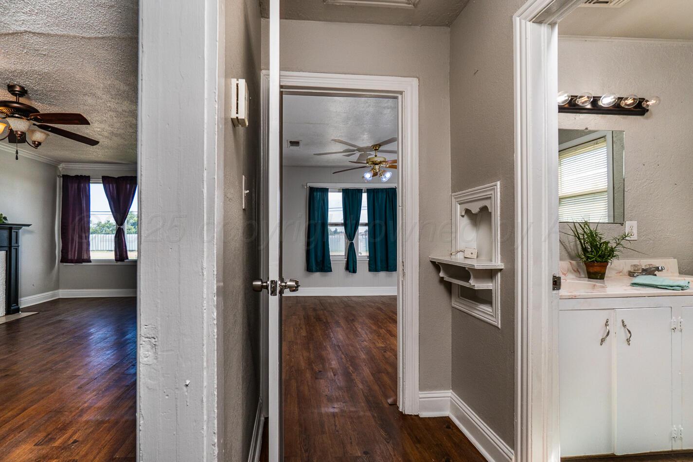 8015 Upton Road Amarillo, TX 79119 - Photo 14 of 16 a view of a kitchen from the hallway