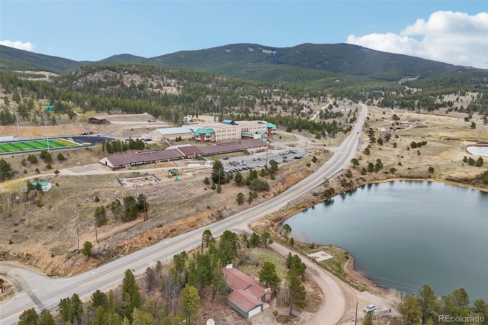 61 Evergreen Road Black Hawk, CO 80422 - Photo 1 of 50 a view of a lake with a mountain