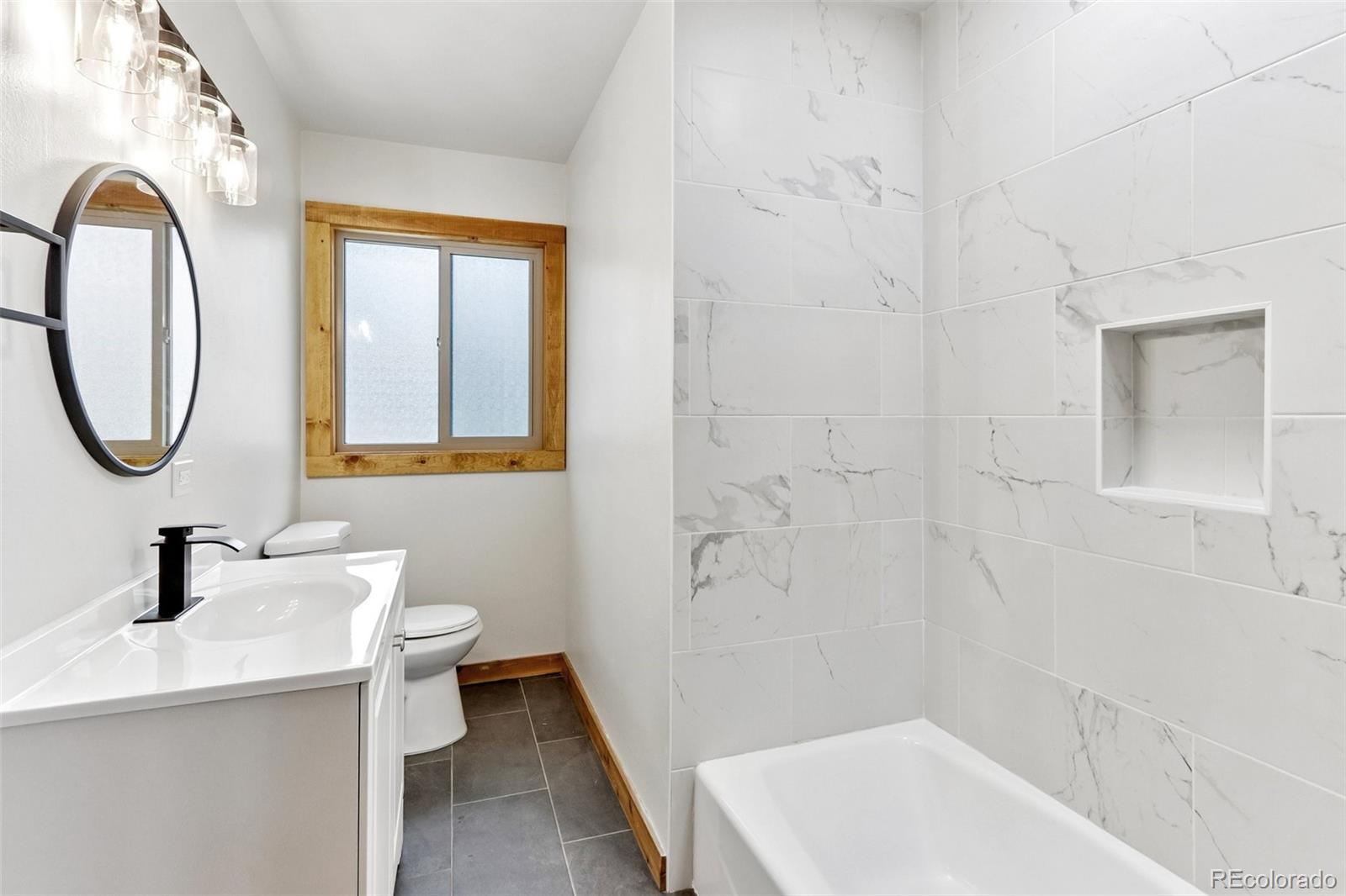 61 Evergreen Road Black Hawk, CO 80422 - Photo 19 of 50 a bathroom with a sink a toilet and shower