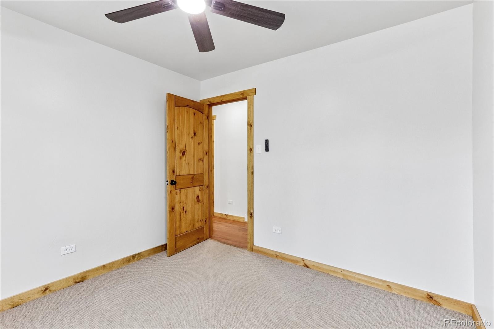 61 Evergreen Road Black Hawk, CO 80422 - Photo 25 of 50 an empty room with a empty space and a ceiling fan