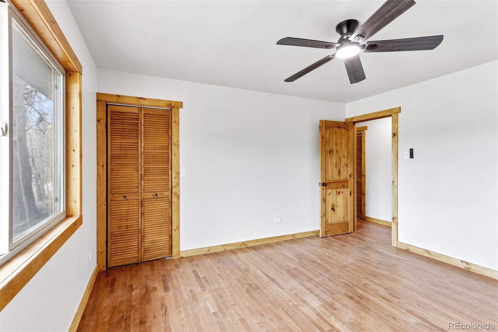 61 Evergreen Road Black Hawk, CO 80422 - Photo 27 of 50 a view of empty room with wooden floor and fan