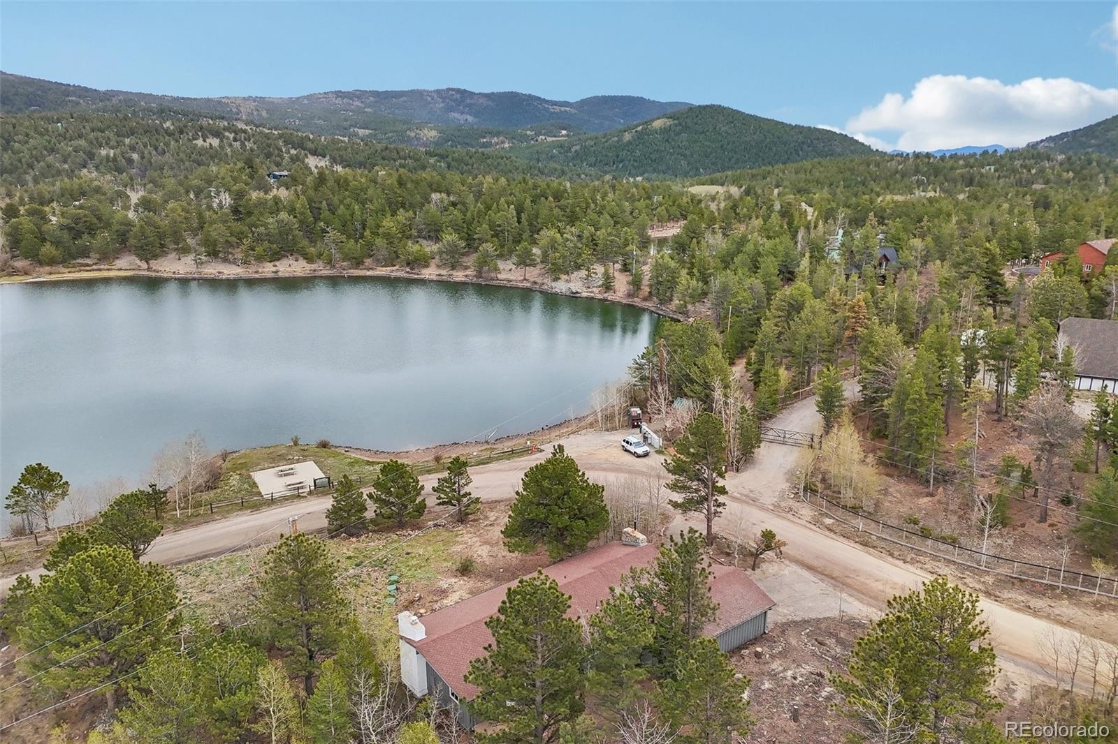 61 Evergreen Road Black Hawk, CO 80422 - Photo 50 of 50 a view of a lake with a mountain in the background