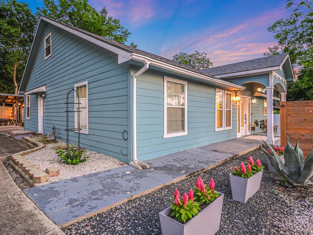 5405 Manor Road Austin, TX 78723 - Photo 25 of 30 View of side of home featuring a patio