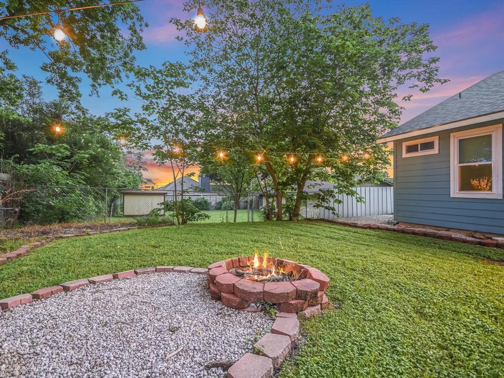 5405 Manor Road Austin, TX 78723 - Photo 28 of 30 Fenced backyard featuring a fire pit