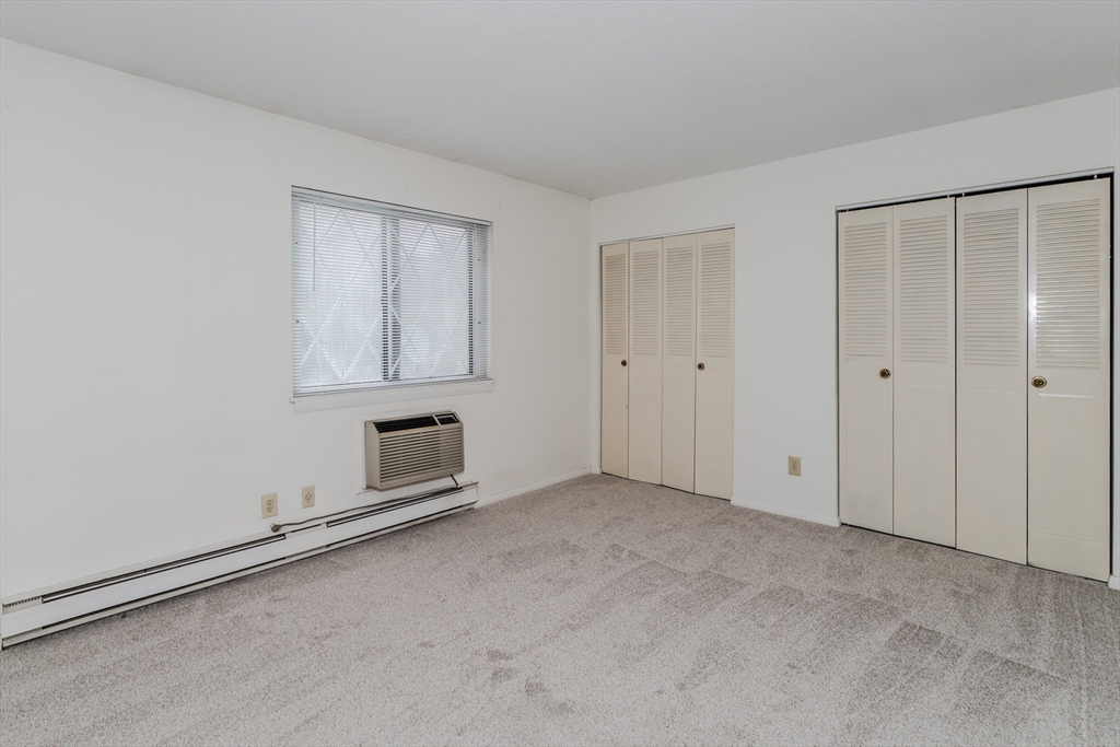 170 East Hadley Road, Unit 123 Amherst, MA 01002 - Photo 15 of 23 a view of an empty room with closet and entryway