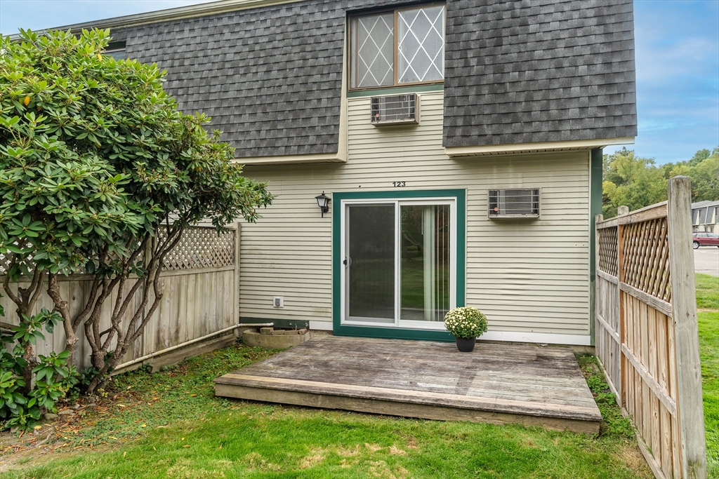 170 East Hadley Road, Unit 123 Amherst, MA 01002 - Photo 4 of 23 a view of a house with a yard