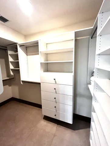 a view of living room filled with furniture and window