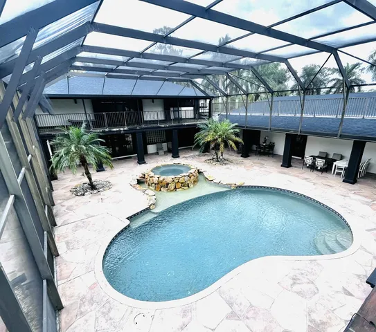 a view of living room with furniture and a flat screen tv