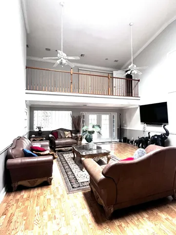 a bedroom with a large bed and a large mirror