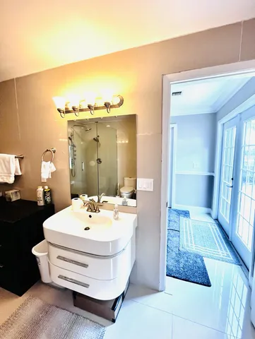 a living room with furniture pool table and chairs