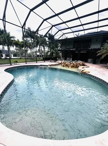 a kitchen with a table and chairs