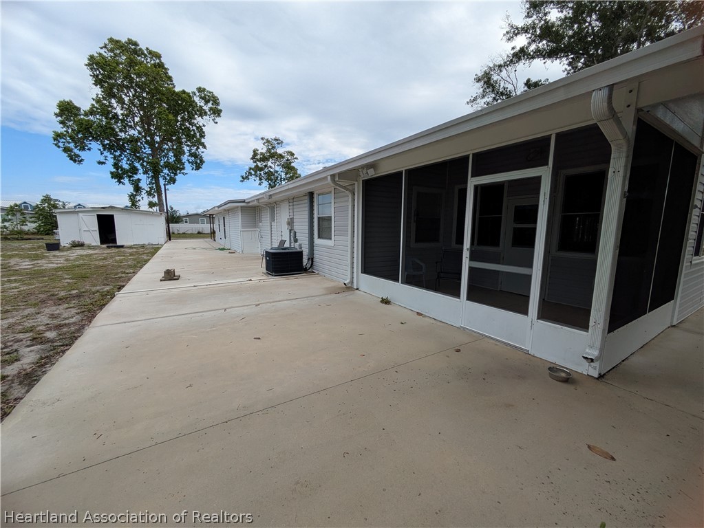 2701 Brunns Road Sebring, FL 33872 - Photo 20 of 29 a front view of a house with a yard and garage