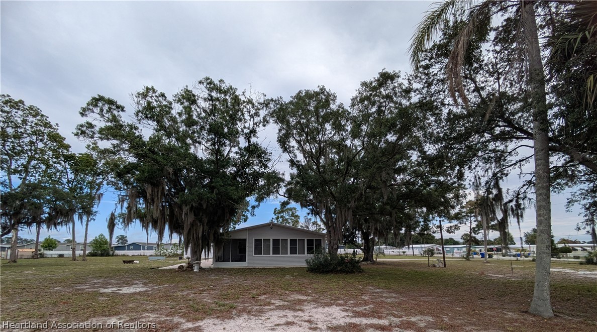 2701 Brunns Road Sebring, FL 33872 - Photo 26 of 29 a front view of a house with a yard