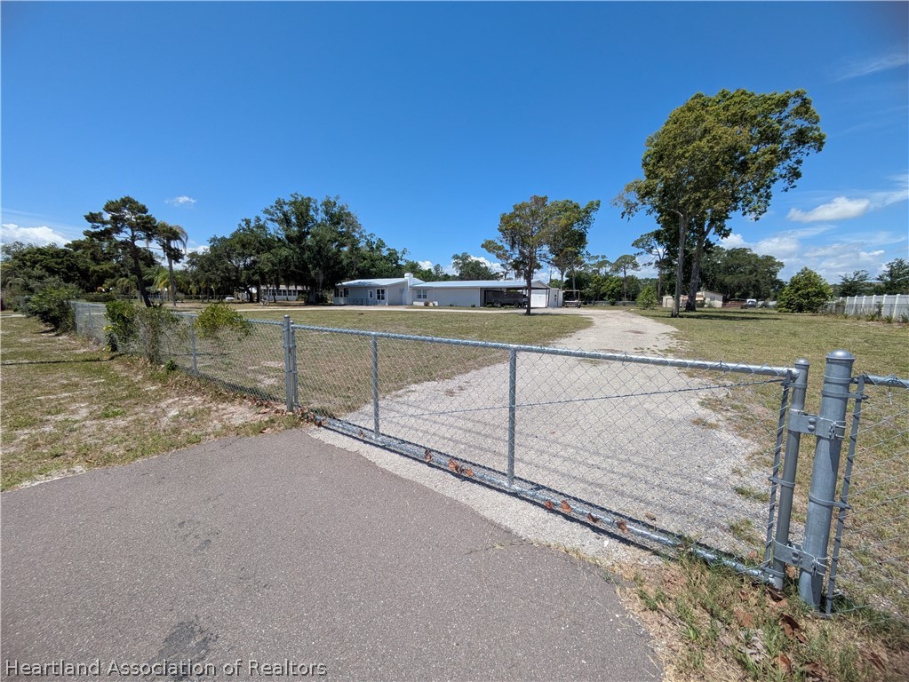 2701 Brunns Road Sebring, FL 33872 - Photo 27 of 29 a view of an outdoor space and tennis court