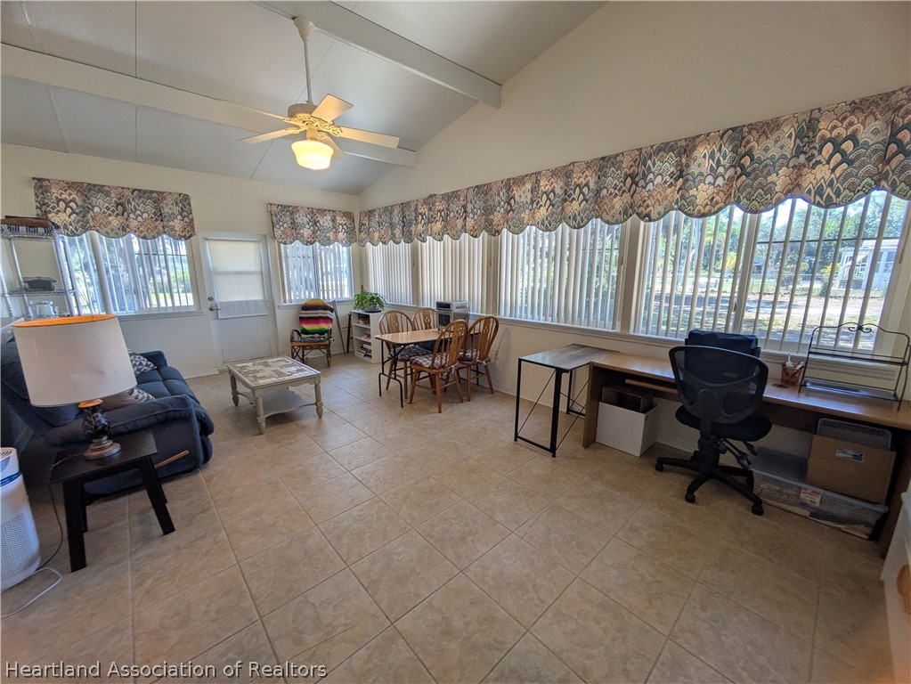 2701 Brunns Road Sebring, FL 33872 - Photo 8 of 29 a view of a livingroom with workspace and a window