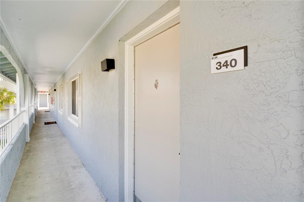 129 Blue Pointe Way, Unit 340 Altamonte Springs, FL 32701 - Photo 2 of 25 a view of a hallway with wooden floor