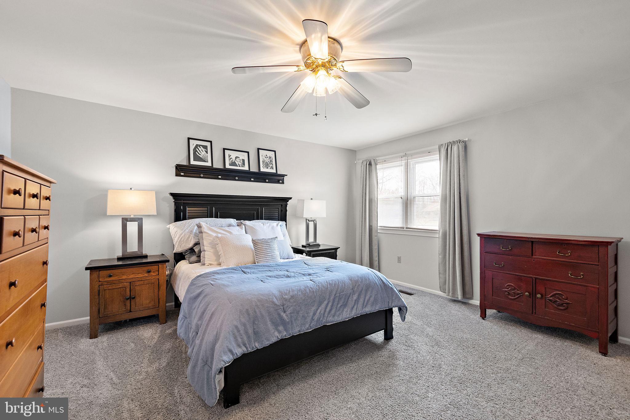 1003 White Birch Drive Newark, DE 19713 - Photo 23 of 54 a bedroom with a bed dresser and a window