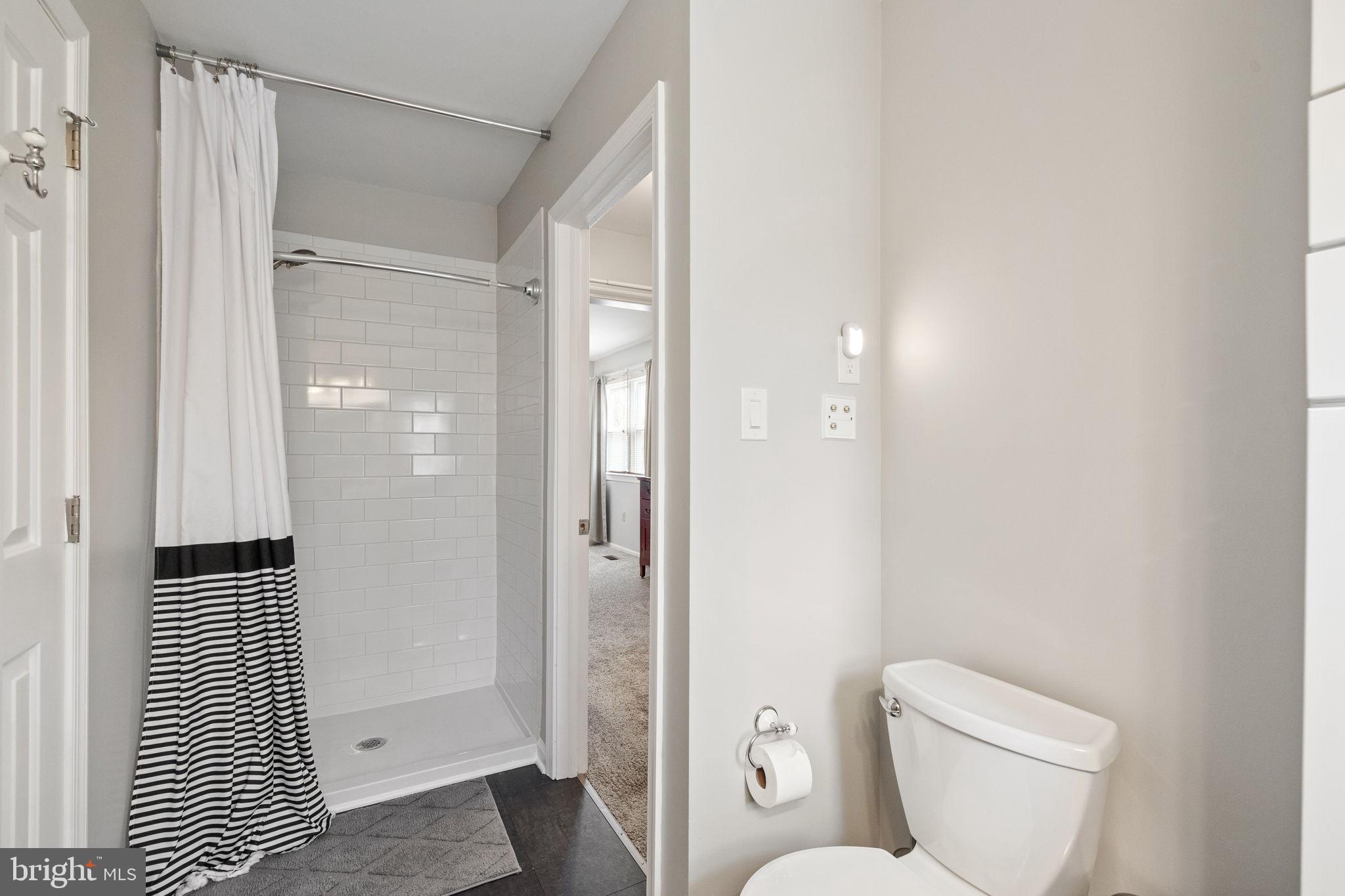 1003 White Birch Drive Newark, DE 19713 - Photo 25 of 54 a bathroom with a toilet and a shower