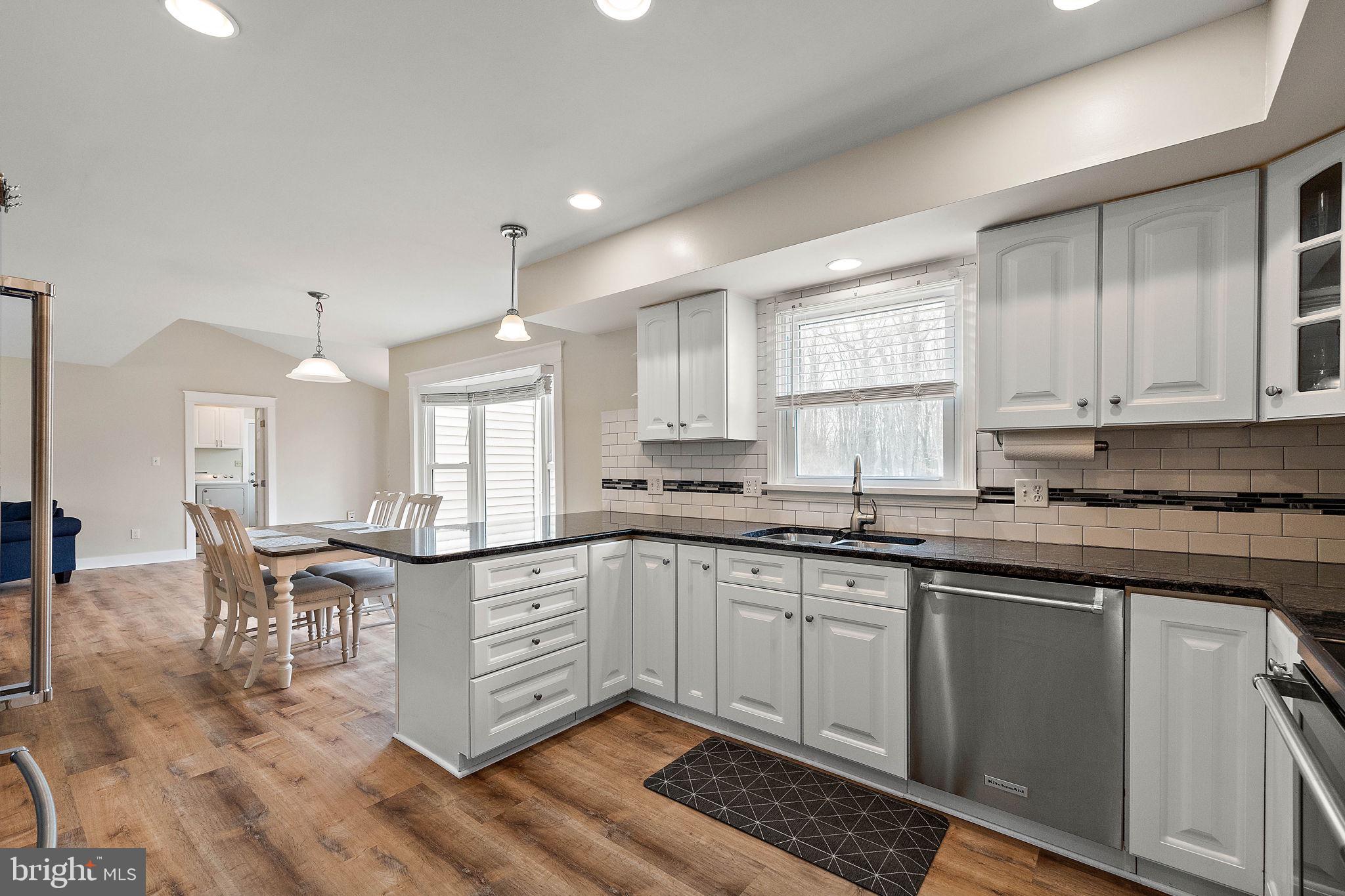 1003 White Birch Drive Newark, DE 19713 - Photo 3 of 54 a kitchen with lots of counter top space and dining table