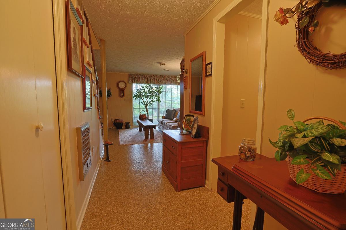 56 Claymont Road McIntyre, GA 31054 - Photo 21 of 75 a living room with furniture and a window