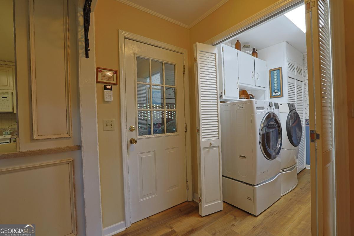 56 Claymont Road McIntyre, GA 31054 - Photo 47 of 75 a utility room with dryer and washer