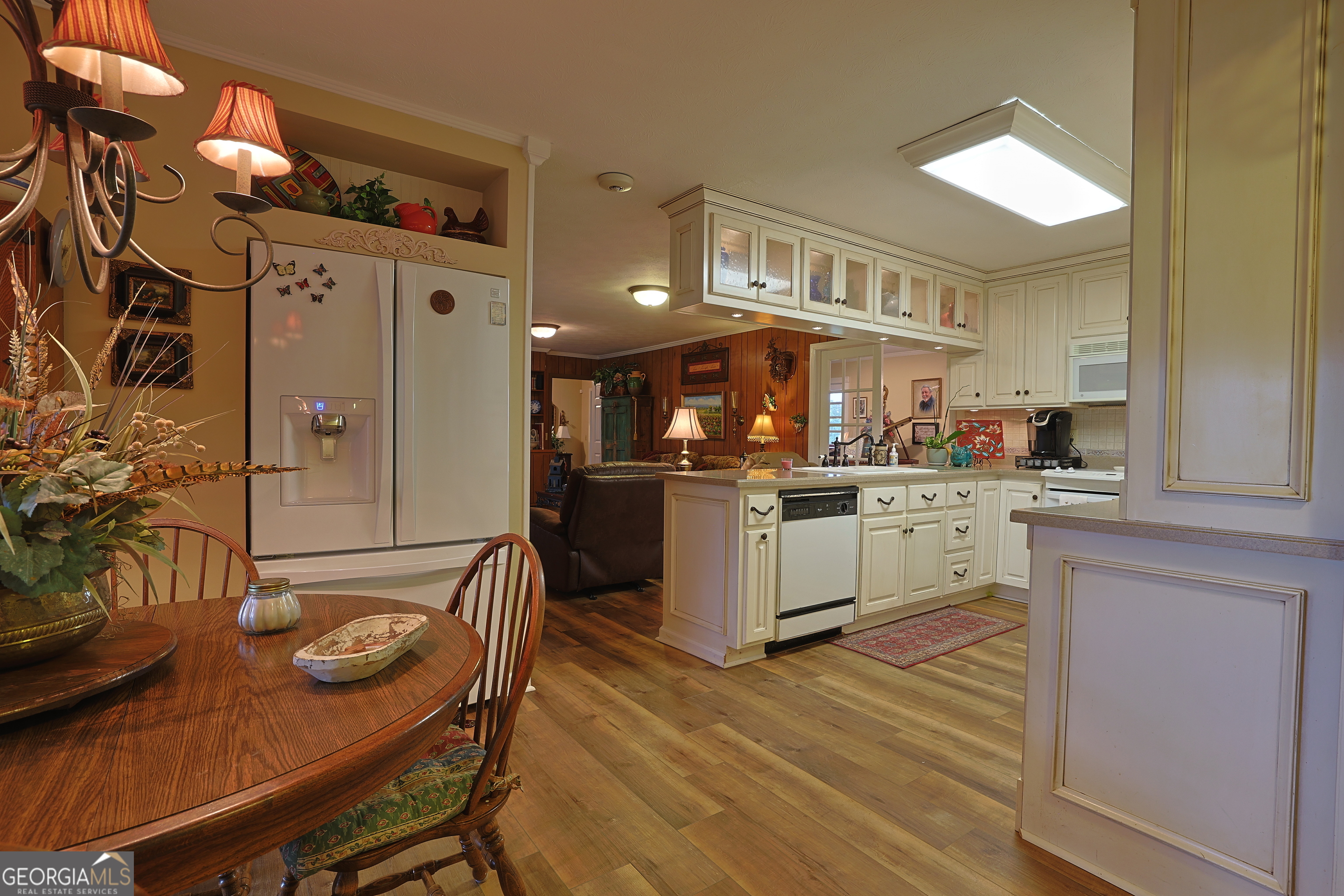 56 Claymont Road McIntyre, GA 31054 - Photo 73 of 75 a kitchen with stainless steel appliances kitchen island granite countertop a sink and cabinets