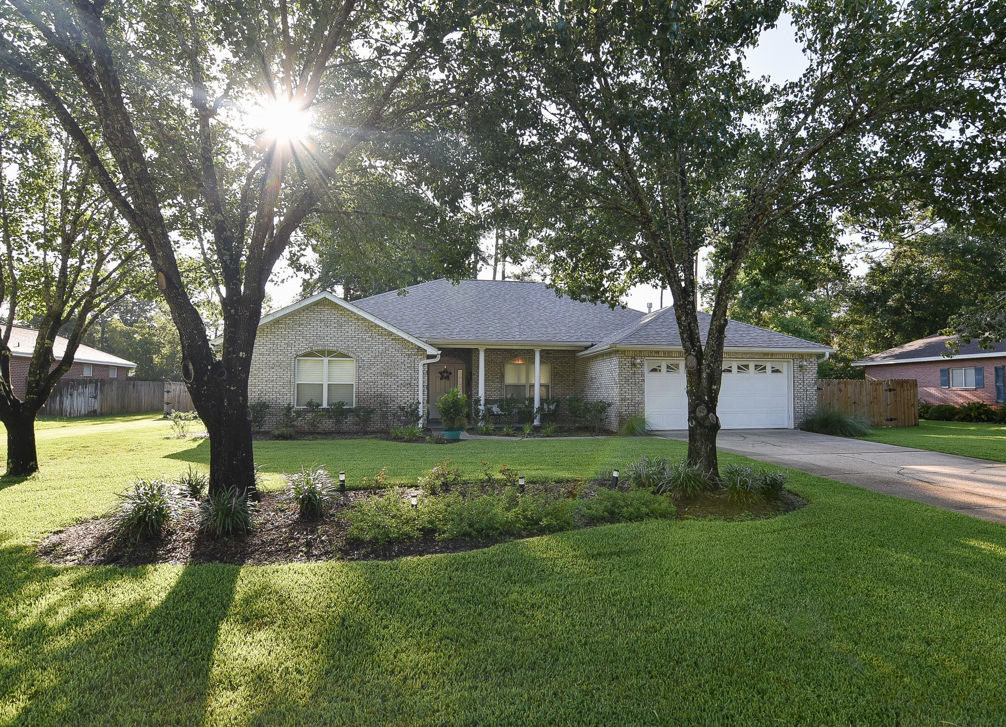 1815 Huntington Road Niceville, FL 32578 - Photo 1 of 51 a front view of a house with garden
