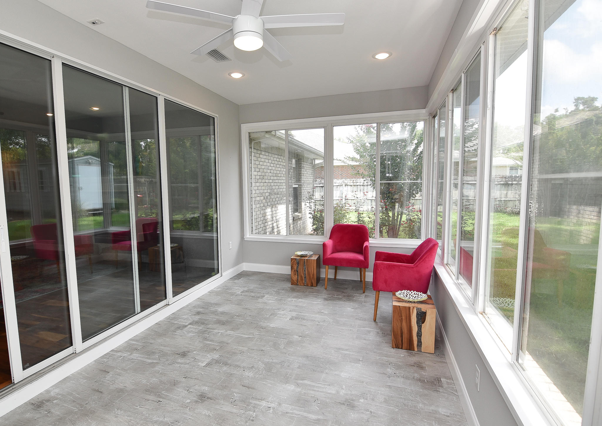 1815 Huntington Road Niceville, FL 32578 - Photo 14 of 51 a living room with furniture a floor to ceiling window and a table
