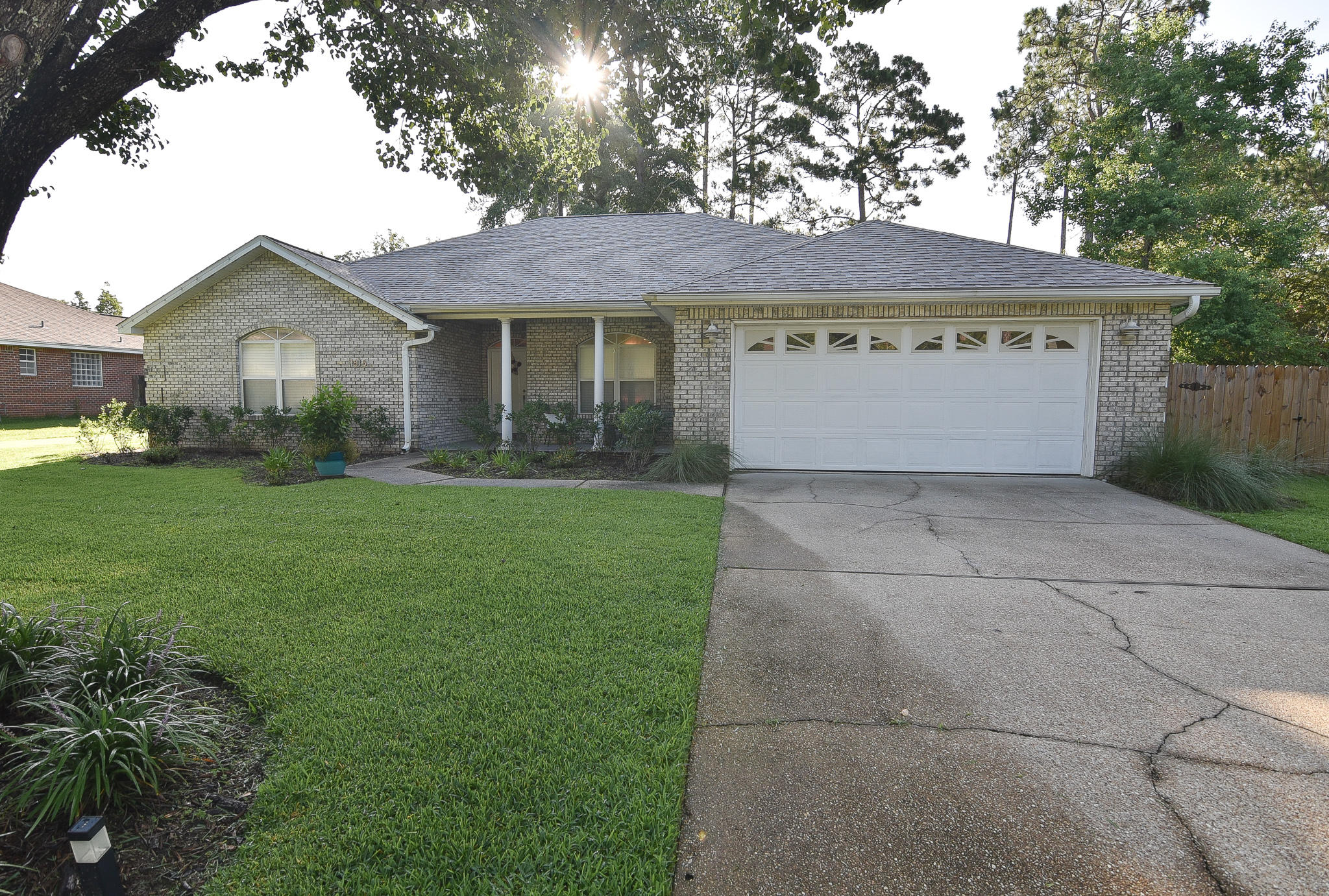 1815 Huntington Road Niceville, FL 32578 - Photo 3 of 51 a view of a house with a yard and potted plants