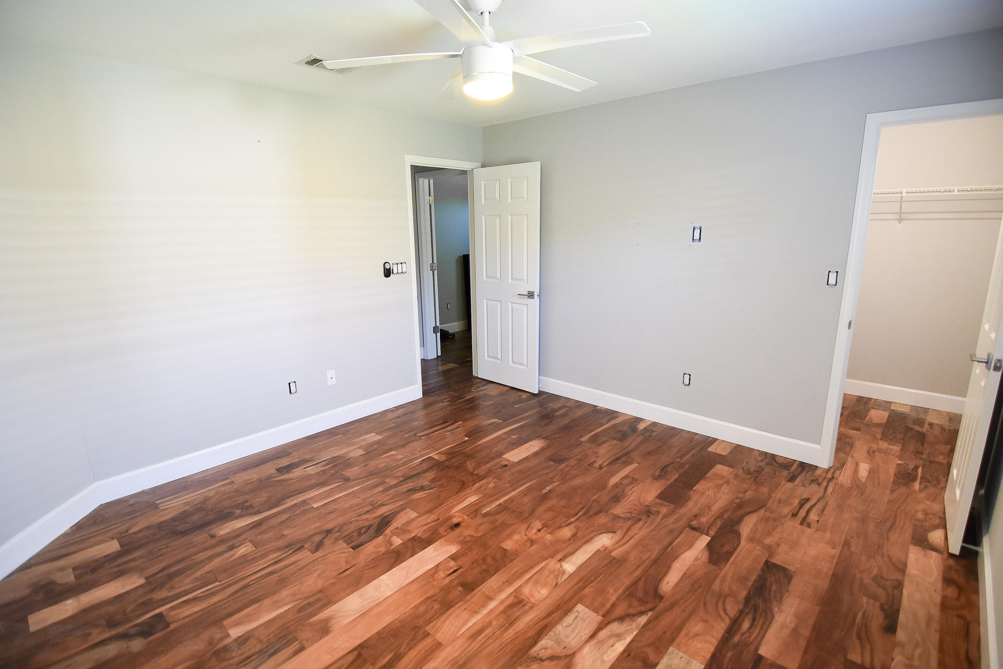 1815 Huntington Road Niceville, FL 32578 - Photo 36 of 51 an empty room with wooden floor and fan