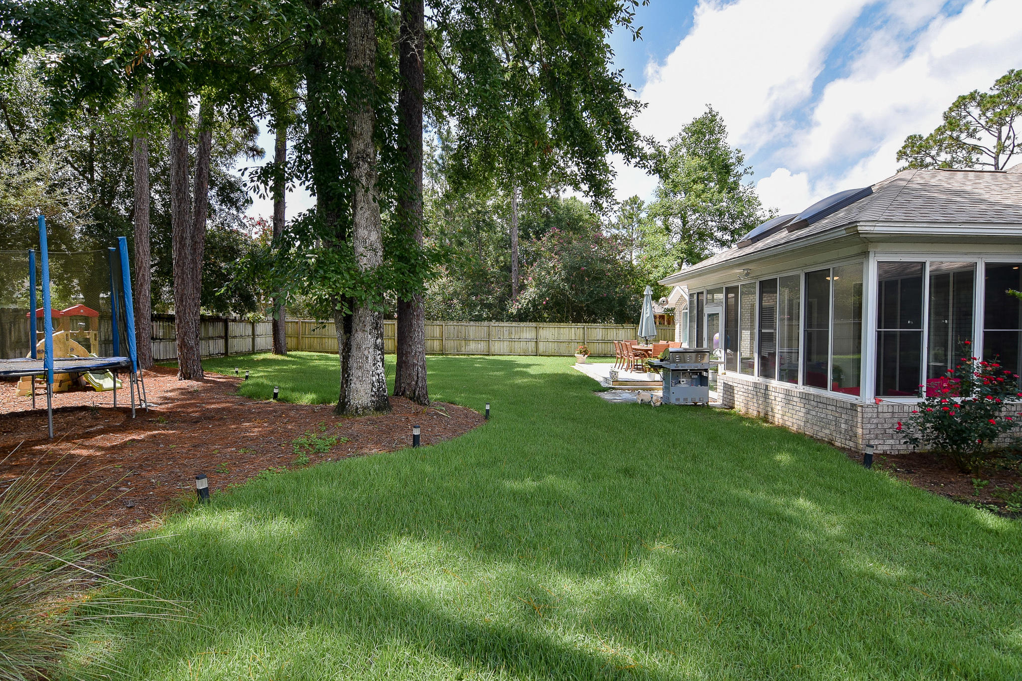 1815 Huntington Road Niceville, FL 32578 - Photo 40 of 51 a view of a house with backyard and a tree