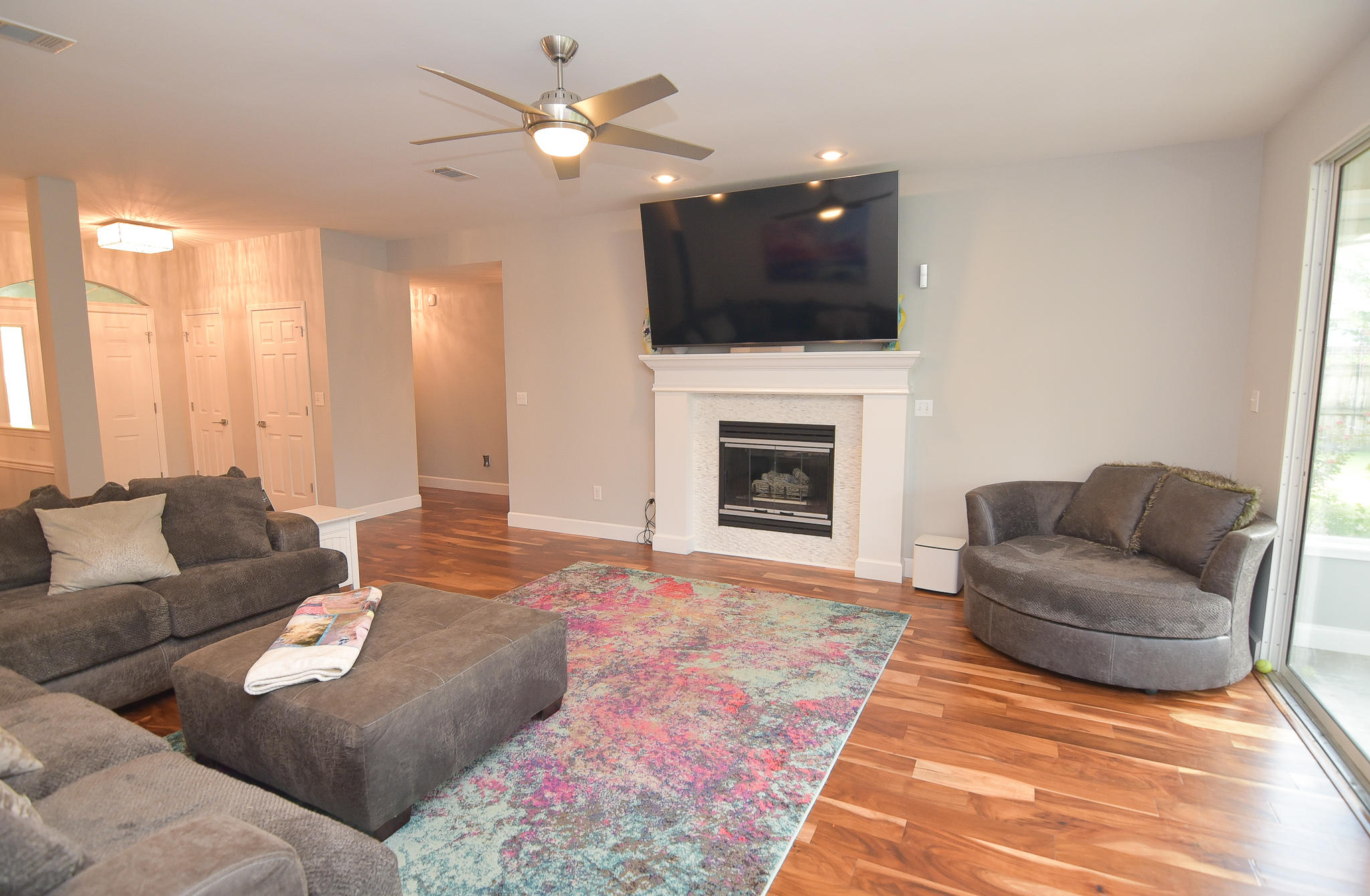 1815 Huntington Road Niceville, FL 32578 - Photo 9 of 51 a living room with furniture a fireplace and a flat screen tv