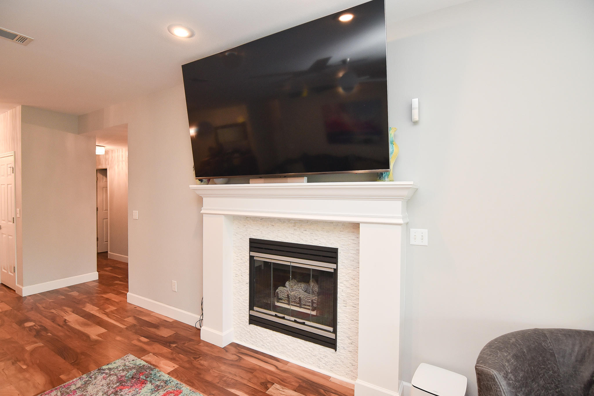 1815 Huntington Road Niceville, FL 32578 - Photo 10 of 51 a living room with a fireplace and a flat screen tv