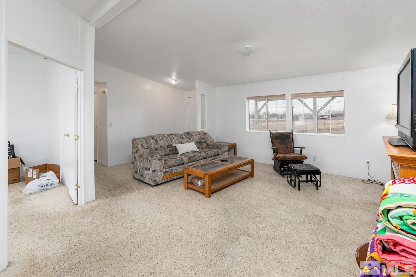 5215 Workman Road Fallon, NV 89406 - Photo 5 of 21 a living room with furniture and a flat screen tv