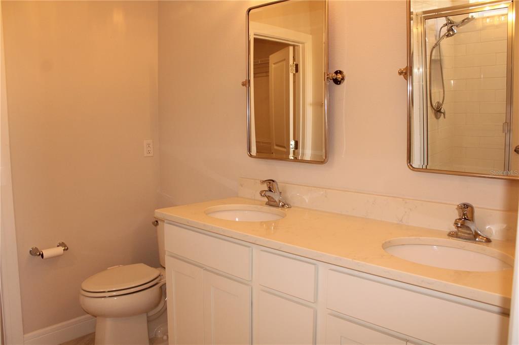 8232 Reefbay Cove Parrish, FL 34221 - Photo 23 of 64 a bathroom with a sink and a toilet