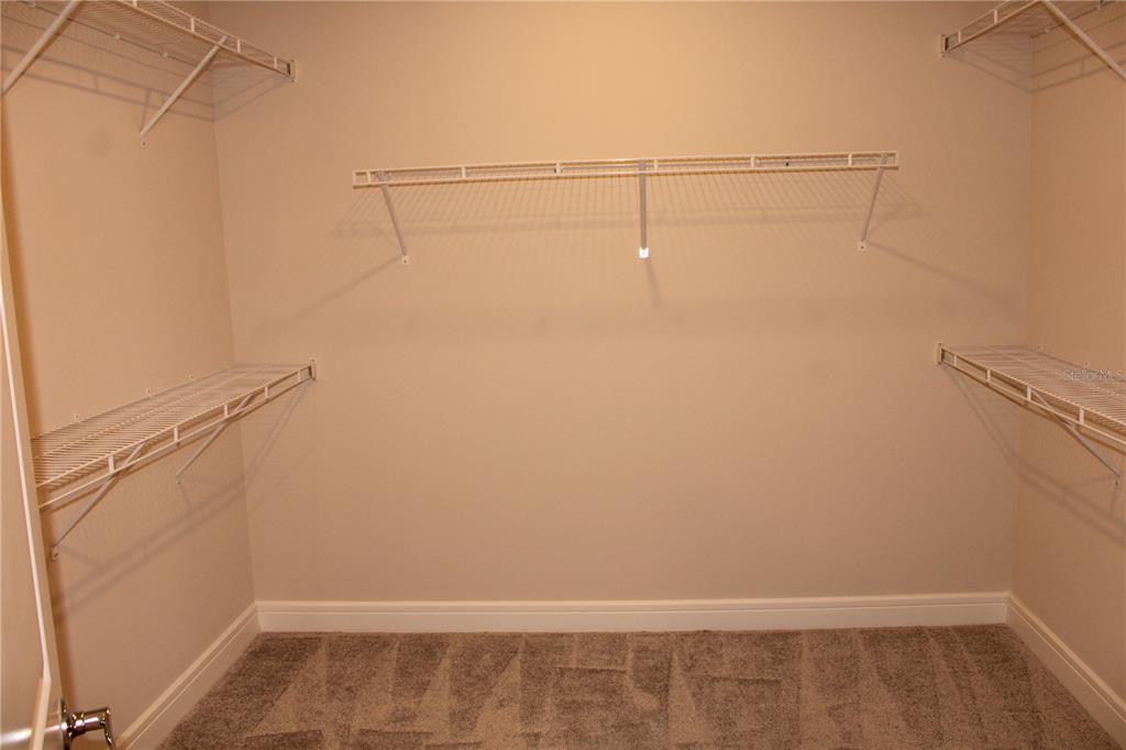 8232 Reefbay Cove Parrish, FL 34221 - Photo 27 of 64 a view of a room with racks on the wall