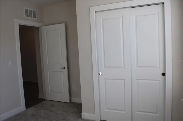 a view of a glass door with a floor to ceiling window